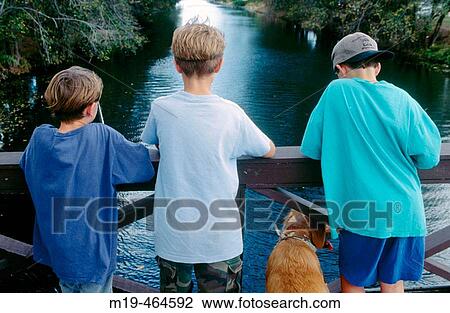 boys fishing from a bridge View Large Photo Image Stock Image - boys fishing from a bridge. Fotosearch