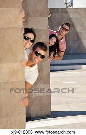 Boys hidden behind the wall. View Large Photo Image Stock Image - Boys hidden behind the wall.. Fotosearch