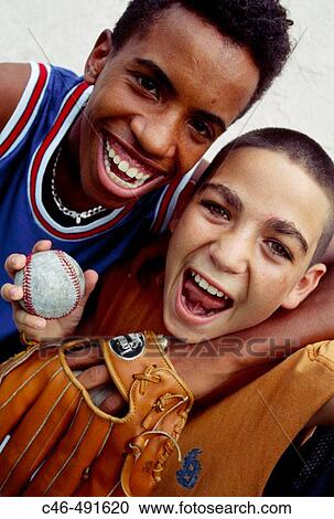 Stock Image - Boys holding a baseball, Little Havana. Miami, Florida. USA. Fotosearch