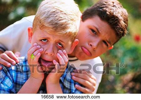 Boys making faces View Large Photo Image Stock Photo - Boys making faces. Fotosearch