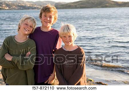 Boys on Plimmerton beach, New Zealand View Large Photo Image Stock Image - Boys on Plimmerton beach, New Zealand. Fotosearch