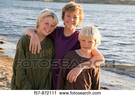 Boys on Plimmerton beach, New Zealand View Large Photo Image Stock Image - Boys on Plimmerton beach, New Zealand. Fotosearch