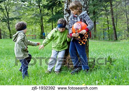 Boys playing outdoor with ball. Older boy took the ball to the younger one causing conflict. View Large Photo Image Stock Image - Boys playing outdoor with ball. Older boy took the ball to the younger one causing conflict.. Fotosearch