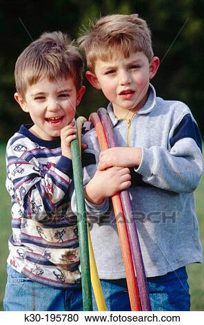 Boys playing outdoors View Large Photo Image Stock Image - Boys playing outdoors. Fotosearch