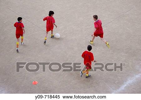 Boys playing soccer View Large Photo Image Stock Photography - Boys playing soccer. Fotosearch