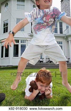 Stock Image - Boys playing. Fotosearch