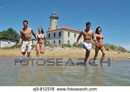 Boys running water. View Large Photo Image Stock Photo - Boys running water.. Fotosearch