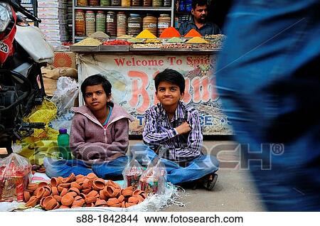 Boys selling cray oil lamp for Diwali festival View Large Photo Image Picture - Boys selling cray oil lamp for Diwali festival. Fotosearch