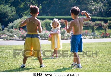 Boys showing of muscles View Large Photo Image Stock Photo - Boys showing of muscles. Fotosearch