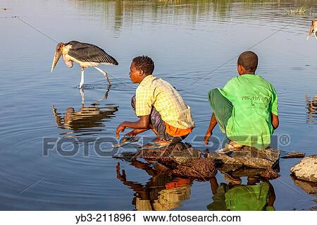 Boys Washing In The Lake, The Fish Market, Lake Hawassa, Hawassa, Ethiopia. View Large Photo Image Stock Image - Boys Washing In The Lake, The Fish Market, Lake Hawassa, Hawassa, Ethiopia.. Fotosearch