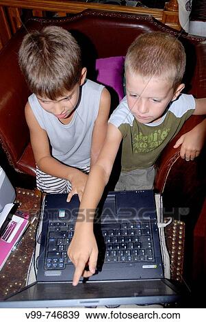 Stock Photo - Boys with computer. Fotosearch