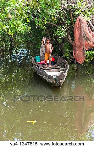 Boys with snakes Floating village Tonle Sap Lake Near Siem Reap Cambodia Southeast Asia Indochina View Large Photo Image Stock Photography - Boys with snakes Floating village Tonle Sap Lake Near Siem Reap Cambodia Southeast Asia Indochina. Fotosearch