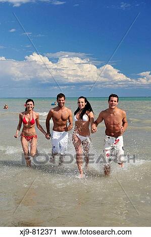 Boyss running on the beach. View Large Photo Image Stock Image - Boyss running on the beach.. Fotosearch