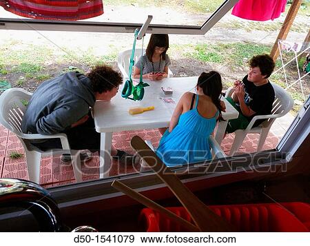 BRACCIANO ITALY Kids playing cards at a campsite. View Large Photo Image Stock Photo - BRACCIANO ITALY Kids playing cards at a campsite.. Fotosearch