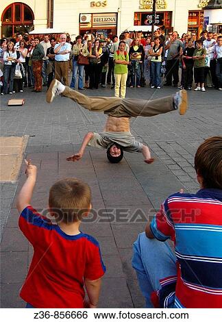 Brakedance, street performance at Mian Market Square, Krakow, Poland View Large Photo Image Stock Photograph - Brakedance, street performance at Mian Market Square, Krakow, Poland. Fotosearch