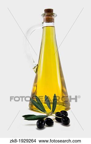 Branch with olives and a bottle of olive oil isolated on white View Large Photo Image Picture - Branch with olives and a bottle of olive oil isolated on white. Fotosearch
