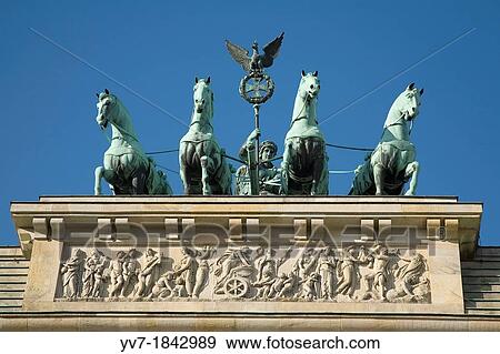 Brandenburg Gate is topped with a copper sculpture, the Quadriga, created by Johann Gottfried Schawdow Berlin, Germany, Europe View Large Photo Image Stock Photo - Brandenburg Gate is topped with a copper sculpture, the Quadriga, created by Johann Gottfried Schawdow Berlin, Germany, Europe. Fotosearch