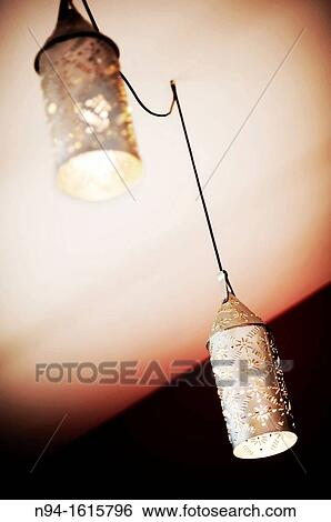 Brass lamps hanging from the ceiling. View Large Photo Image Stock Photograph - Brass lamps hanging from the ceiling.. Fotosearch