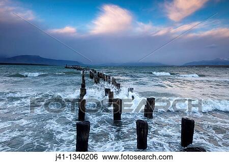 ? Braun & Blanchard? famous old pier, storm approaching at sunset, Puerto Natales, Patagonia, Chile. View Large Photo Image Stock Photograph - ? Braun & Blanchard? famous old pier, storm approaching at sunset, Puerto Natales, Patagonia, Chile.. Fotosearch