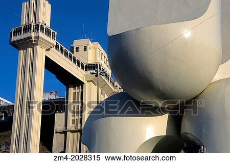 BRAZIL, SALVADOR DE BAHIA, STATUE, WITH ELEVATOR IN BACKROUND, DETAIL. View Large Photo Image Stock Photography - BRAZIL, SALVADOR DE BAHIA, STATUE, WITH ELEVATOR IN BACKROUND, DETAIL.. Fotosearch
