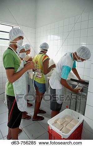 Brazil. Workshop for extracting and packaging fruit pulp, Socorro, near Pesqueira, Pernambuco. Teenagers putting the pulp of the guanabana fruit into plastic bags and refrigerating the product, to sell in local shops. A CEDAPP project. View Large Photo Image Stock Photography - Brazil. Workshop for extracting and packaging fruit pulp, Socorro, near Pesqueira, Pernambuco. Teenagers putting the pulp of the guanabana fruit into plastic bags and refrigerating the product, to sell in local shops. A CEDAPP project.. Fotosearch