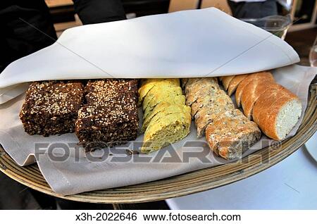 Stock Photograph - bread assortment served at the restaurant Majorenhoff, Majori, Jurmala, Gulf of Riga, Latvia, Baltic region, Northern Europe.. Fotosearch