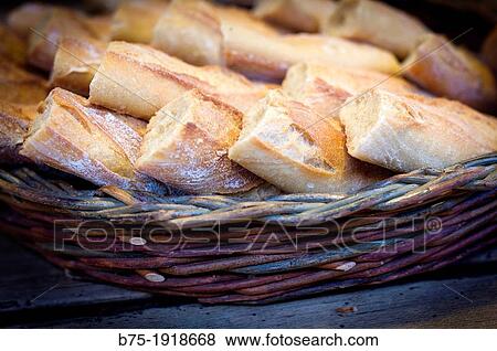 bread basket with slices of baguette on a table View Large Photo Image Stock Photo - bread basket with slices of baguette on a table. Fotosearch