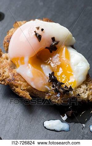 Picture - Bread with egg and truffle at restaurant Solla by chef Pepe Solla, Poio. Pontevedra province, Galicia, Spain. Fotosearch