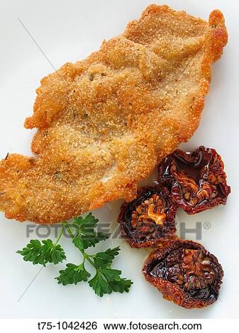 Breaded steak with sundried tomato and olive oil View Large Photo Image Stock Photograph - Breaded steak with sundried tomato and olive oil. Fotosearch