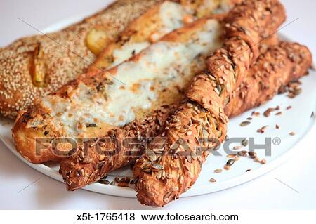 Breadsticks grissini selection of breadsticks topped with poppy seeds, sesame and herbs View Large Photo Image Stock Photo - Breadsticks grissini selection of breadsticks topped with poppy seeds, sesame and herbs. Fotosearch