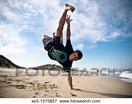 Breakdance in the beach View Large Photo Image Stock Photo - Breakdance in the beach. Fotosearch