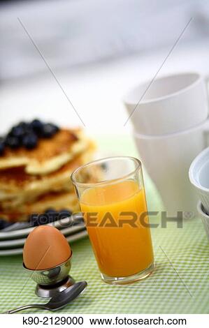 Breakfast arrangement with orange juice, freshly cooked egg and blueberry pancake, Hong Kong, China, Asia View Large Photo Image Stock Image - Breakfast arrangement with orange juice, freshly cooked egg and blueberry pancake, Hong Kong, China, Asia. Fotosearch