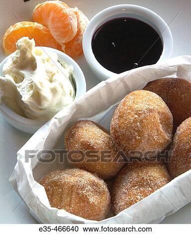 Stock Image - Breakfast, donut holes dried pastry. Fotosearch