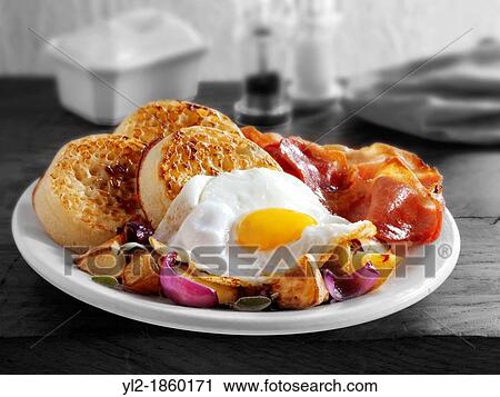 Breakfast with crumpets, fried egg, bacon and sauteed potatoes stock photos View Large Photo Image Stock Image - Breakfast with crumpets, fried egg, bacon and sauteed potatoes stock photos. Fotosearch