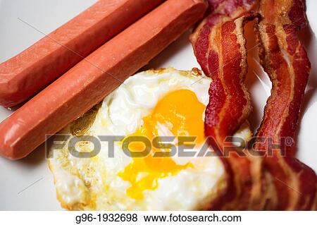 Breakfast with eggs, bacon and sausages View Large Photo Image Stock Photo - Breakfast with eggs, bacon and sausages. Fotosearch