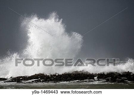 Breaking wave in a stormy morning in the coast of Vila Nova de Milfontes Sudoeste Alentejano e Costa Vicentina Natural Park Portugal View Large Photo Image Stock Image - Breaking wave in a stormy morning in the coast of Vila Nova de Milfontes Sudoeste Alentejano e Costa Vicentina Natural Park Portugal. Fotosearch