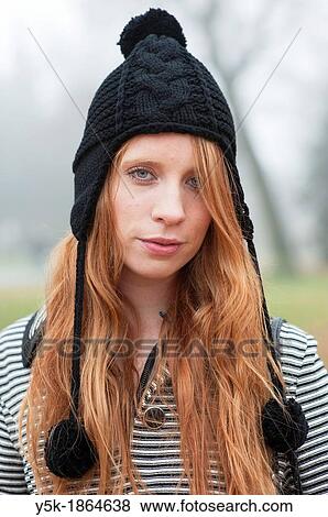 Breda, Netherlands. Young, fashionable and redheaded woman in a city-park. View Large Photo Image Stock Photo - Breda, Netherlands. Young, fashionable and redheaded woman in a city-park.. Fotosearch