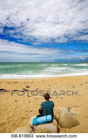Bretagne, Quiberon: contemplation, sitting on a rock facing the sea View Large Photo Image Stock Image - Bretagne, Quiberon: contemplation, sitting on a rock facing the sea. Fotosearch