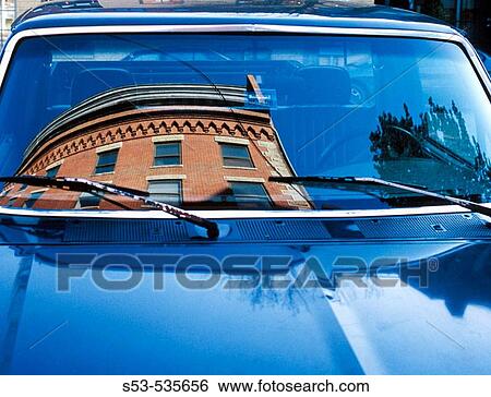 Brick building reflected in windshield in blue car. View Large Photo Image Stock Photograph - Brick building reflected in windshield in blue car.. Fotosearch