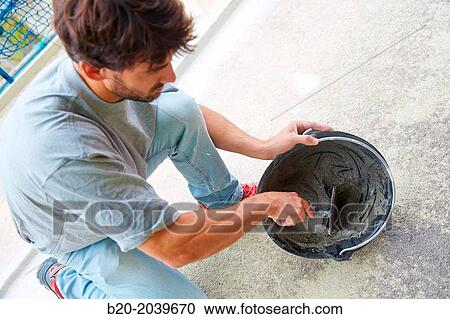 Bricklayer making cement mortar. Construction of residential building. Donostia. San Sebastian. Gipuzkoa. Basque Country. Spain. View Large Photo Image Stock Image - Bricklayer making cement mortar. Construction of residential building. Donostia. San Sebastian. Gipuzkoa. Basque Country. Spain.. Fotosearch