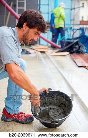 Bricklayer making cement mortar. Construction of residential building. Donostia. San Sebastian. Gipuzkoa. Basque Country. Spain. View Large Photo Image Stock Image - Bricklayer making cement mortar. Construction of residential building. Donostia. San Sebastian. Gipuzkoa. Basque Country. Spain.. Fotosearch