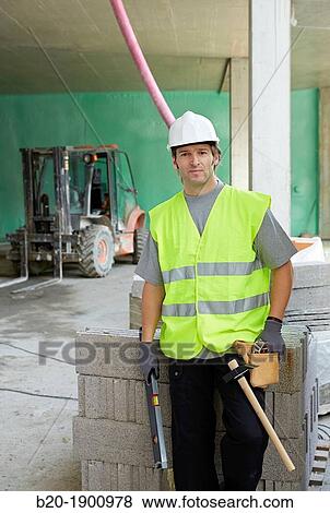 Bricklayer, Mason with personal protective equipment, PPE, Apartment Building under construction, Donostia, San Sebastian, Gipuzkoa, Basque Country, Spain View Large Photo Image Stock Photo - Bricklayer, Mason with personal protective equipment, PPE, Apartment Building under construction, Donostia, San Sebastian, Gipuzkoa, Basque Country, Spain. Fotosearch