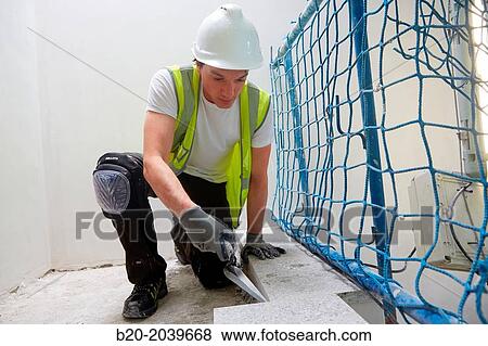 Bricklayer with a trowel. Construction of residential building. Donostia. San Sebastian. Gipuzkoa. Basque Country. Spain. View Large Photo Image Stock Photo - Bricklayer with a trowel. Construction of residential building. Donostia. San Sebastian. Gipuzkoa. Basque Country. Spain.. Fotosearch