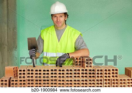 Bricklayer with trowel making a brick wall, Mason with personal protective equipment, PPE, Apartment Building under construction, Donostia, San Sebastian, Gipuzkoa, Basque Country, Spain View Large Photo Image Picture - Bricklayer with trowel making a brick wall, Mason with personal protective equipment, PPE, Apartment Building under construction, Donostia, San Sebastian, Gipuzkoa, Basque Country, Spain. Fotosearch