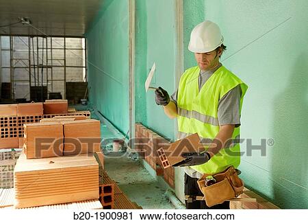 Bricklayer with trowel making a brick wall, Mason with personal protective equipment, PPE, Apartment Building under construction, Donostia, San Sebastian, Gipuzkoa, Basque Country, Spain View Large Photo Image Stock Image - Bricklayer with trowel making a brick wall, Mason with personal protective equipment, PPE, Apartment Building under construction, Donostia, San Sebastian, Gipuzkoa, Basque Country, Spain. Fotosearch