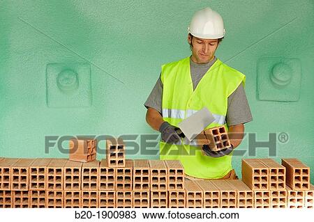 Bricklayer with trowel making a brick wall, Mason with personal protective equipment, PPE, Apartment Building under construction, Donostia, San Sebastian, Gipuzkoa, Basque Country, Spain View Large Photo Image Stock Image - Bricklayer with trowel making a brick wall, Mason with personal protective equipment, PPE, Apartment Building under construction, Donostia, San Sebastian, Gipuzkoa, Basque Country, Spain. Fotosearch