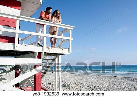 Bridal couple in the booth lifeguard, Miami Beach, Florida, USA. View Large Photo Image Stock Photo - Bridal couple in the booth lifeguard, Miami Beach, Florida, USA.. Fotosearch