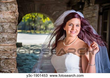 Bridal portrait - A young bride in wedding dress posing at historical looking building at Garner State Park, Concan, Texas, USA, Female Caucasian, 23 years old View Large Photo Image Stock Image - Bridal portrait - A young bride in wedding dress posing at historical looking building at Garner State Park, Concan, Texas, USA, Female Caucasian, 23 years old. Fotosearch
