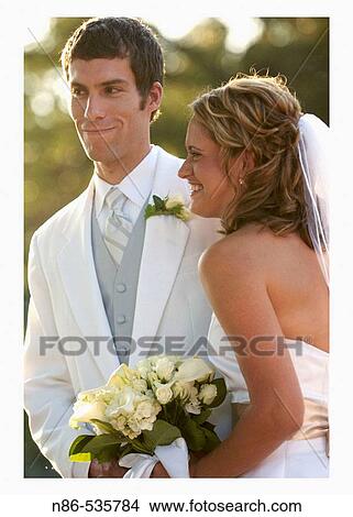 Bride and groom at altar outdoors View Large Photo Image Picture - Bride and groom at altar outdoors. Fotosearch