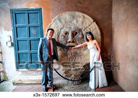 Bride and groom at Bocca della Verit? in Rome Italy View Large Photo Image Stock Photo - Bride and groom at Bocca della Verit? in Rome Italy. Fotosearch